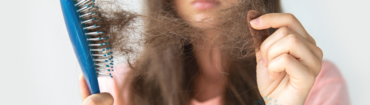 woman experiencing hair loss